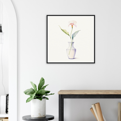 A framed print of a pink flower in a vase