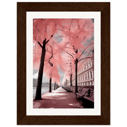 A framed print of a pink tree in a city street