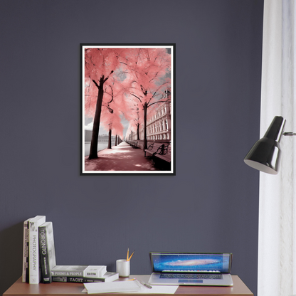 A framed print of a pink tree in a room