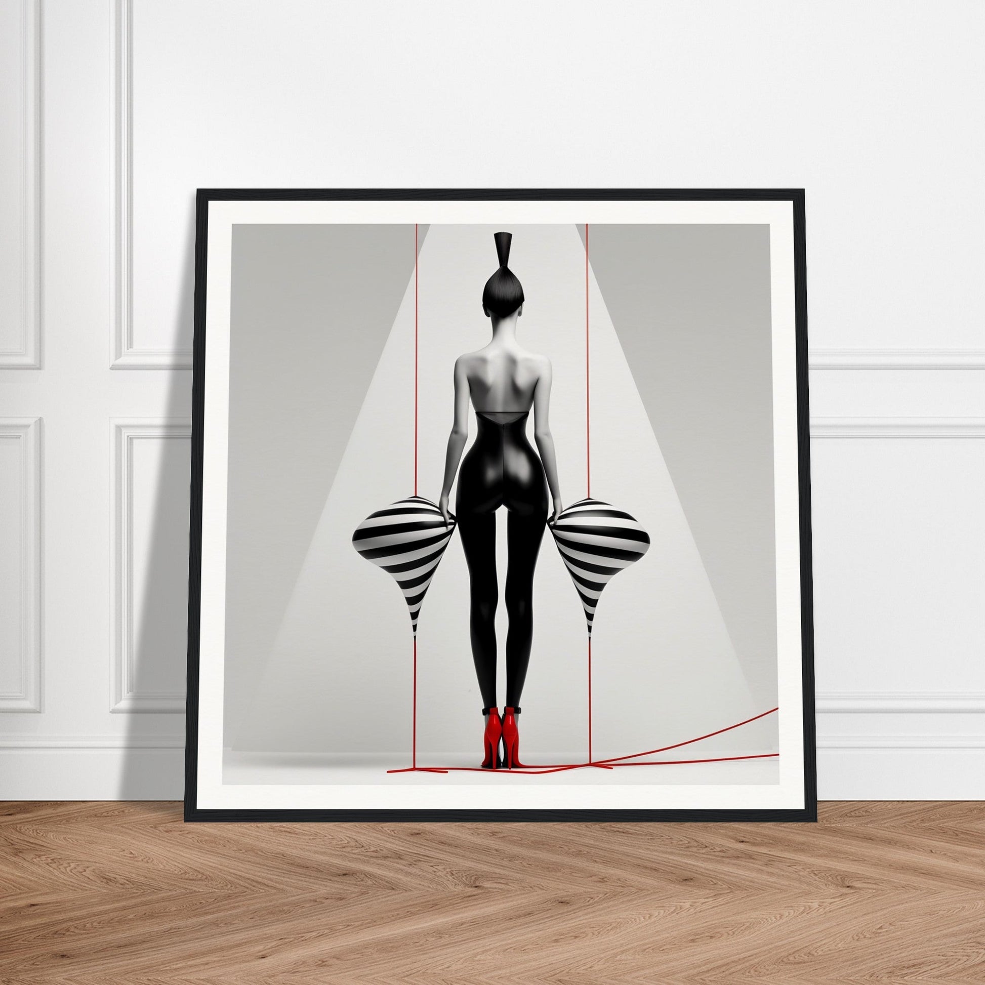 A framed print of a woman in a black and white dress with red shoes