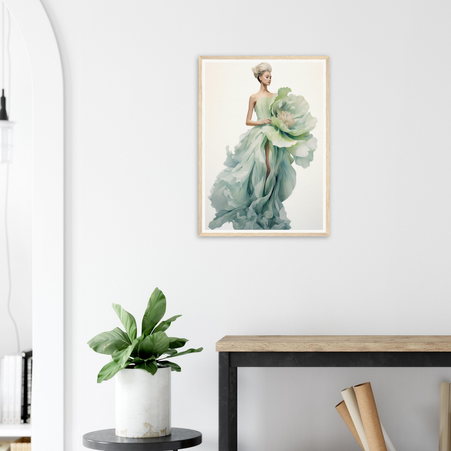 A framed print of a woman in a green dress