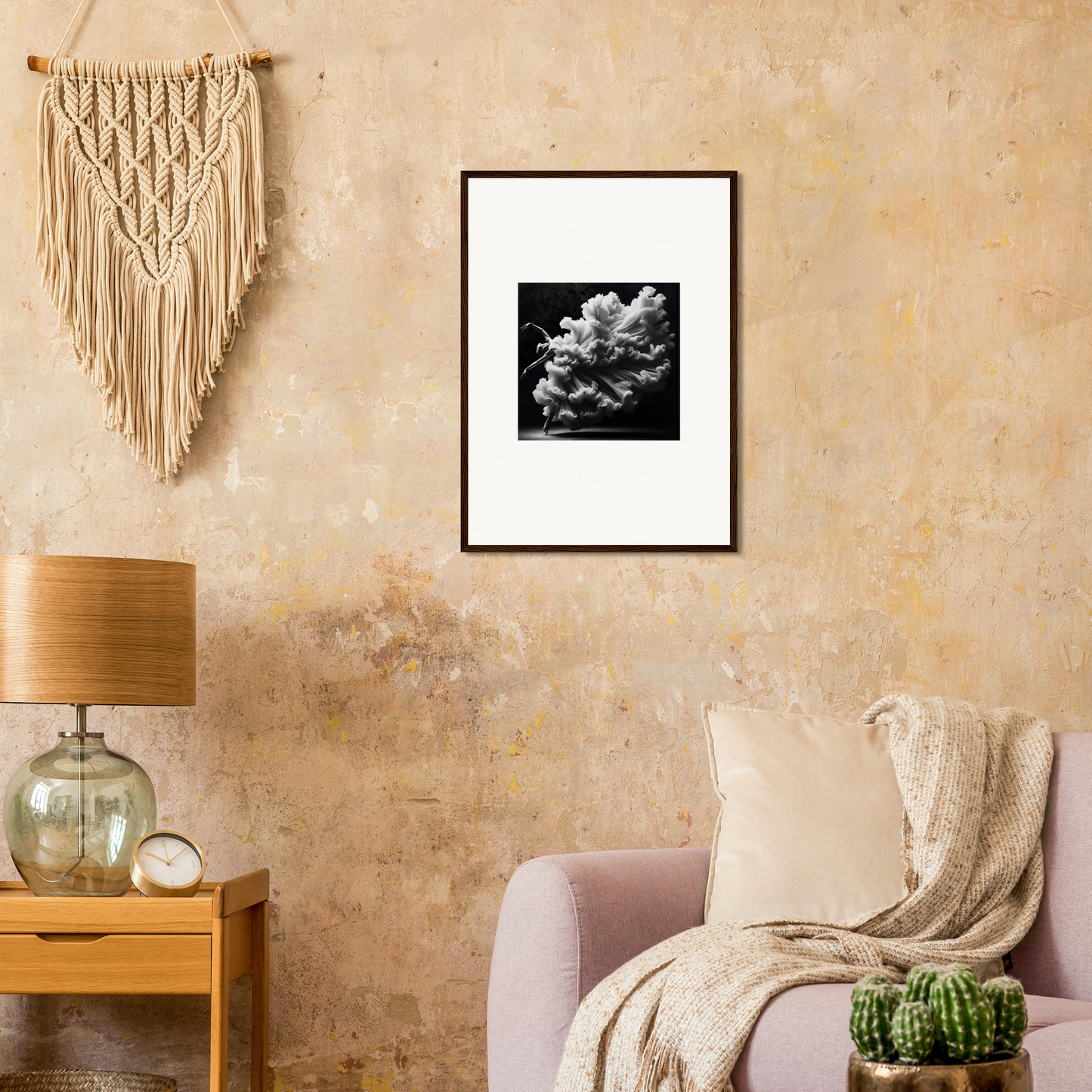 Framed black and white photograph of clouds or smoke against a light background.