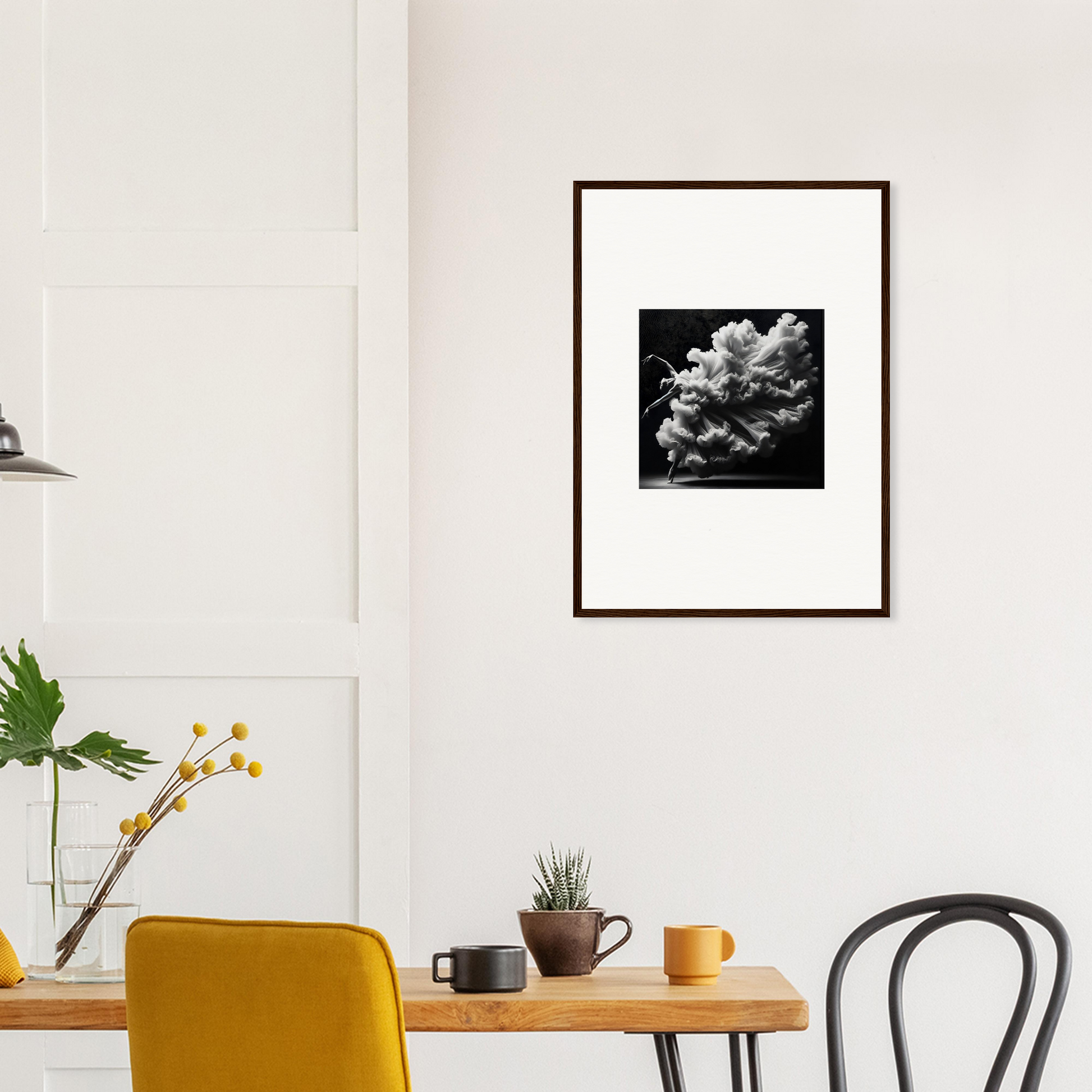 Framed black and white photograph of a cloud formation.