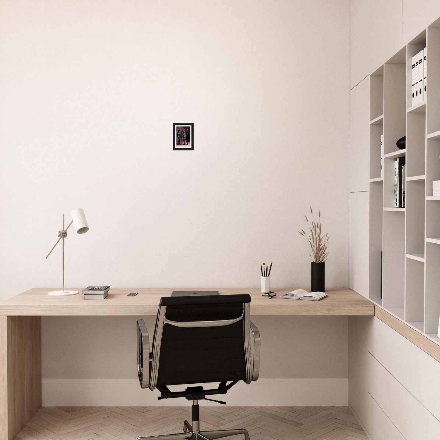 Minimalist wooden desk with a black office chair in a clean, white workspace.