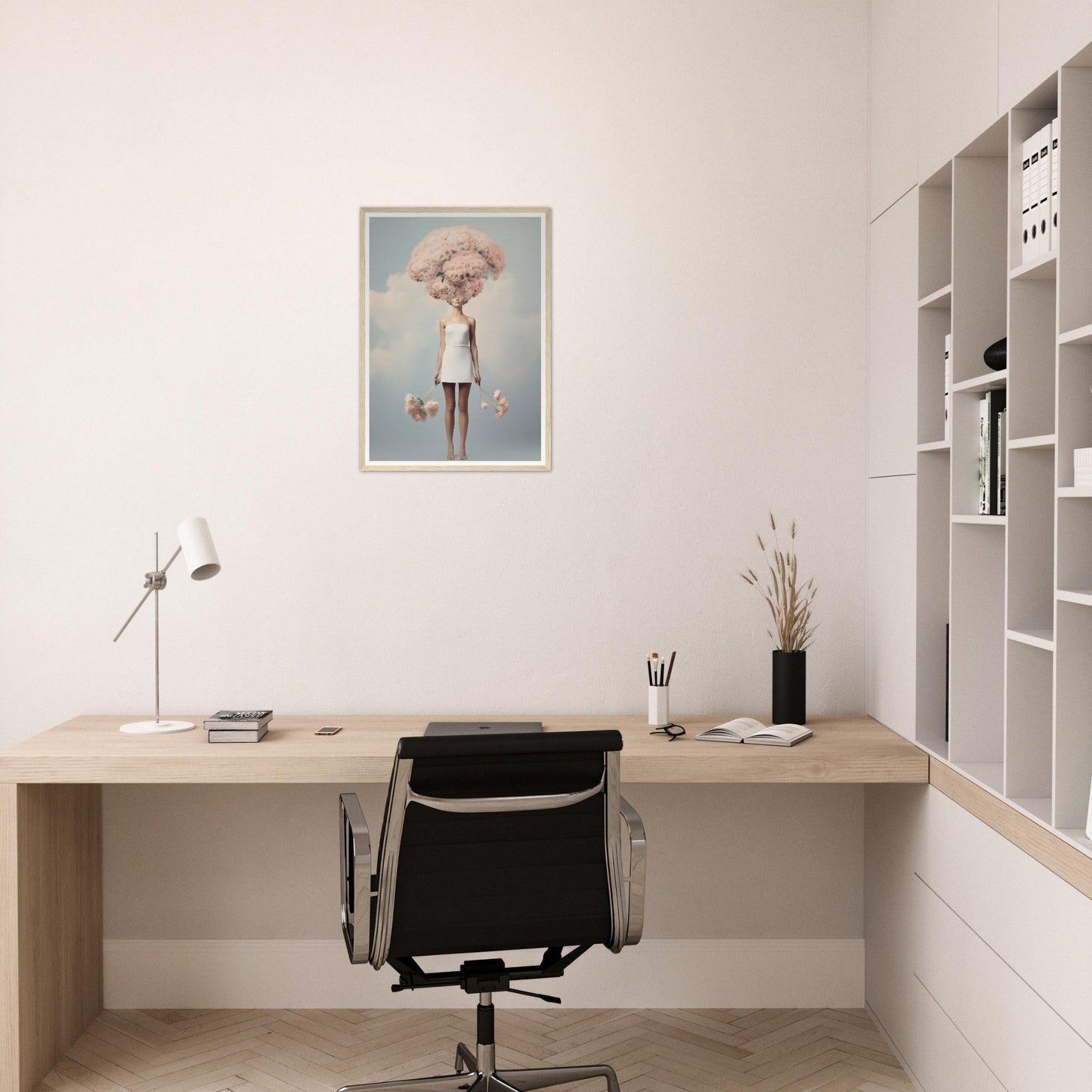 Minimalist home office workspace with a wooden desk, black office chair, and white shelving unit.