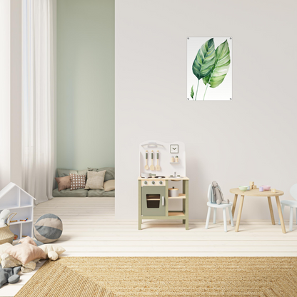 A green leaf on a white wall in a child’s room