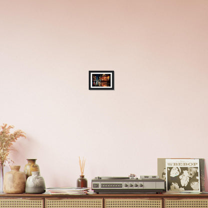 Wooden sideboard or console table with decorative items displayed on top, including vases, a vintage radio, and framed artwork.