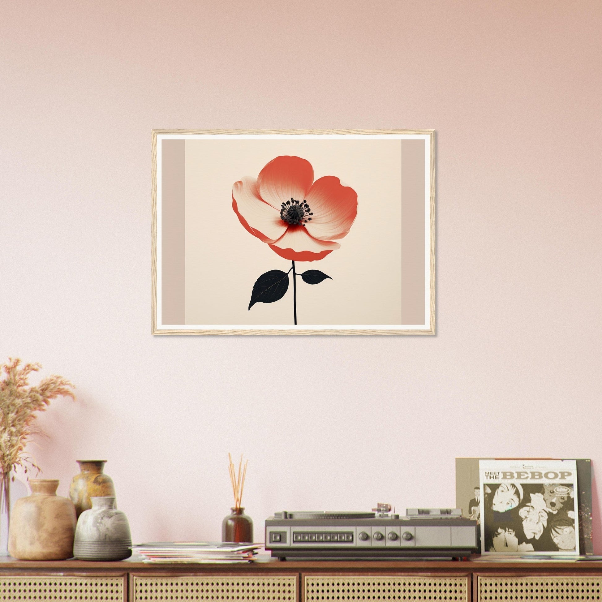 Framed artwork of a single red poppy flower with a black center and stem.