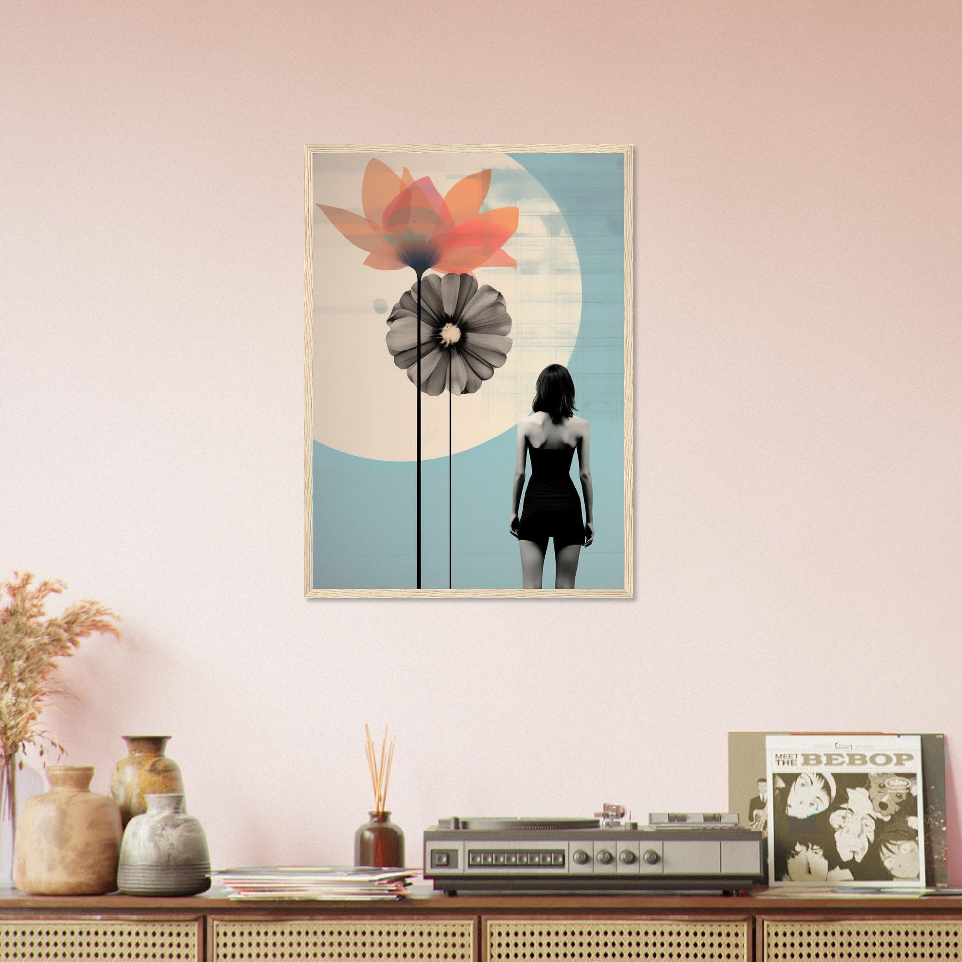 Framed artwork depicting a silhouette of a woman with stylized flowers against a blue and white background.