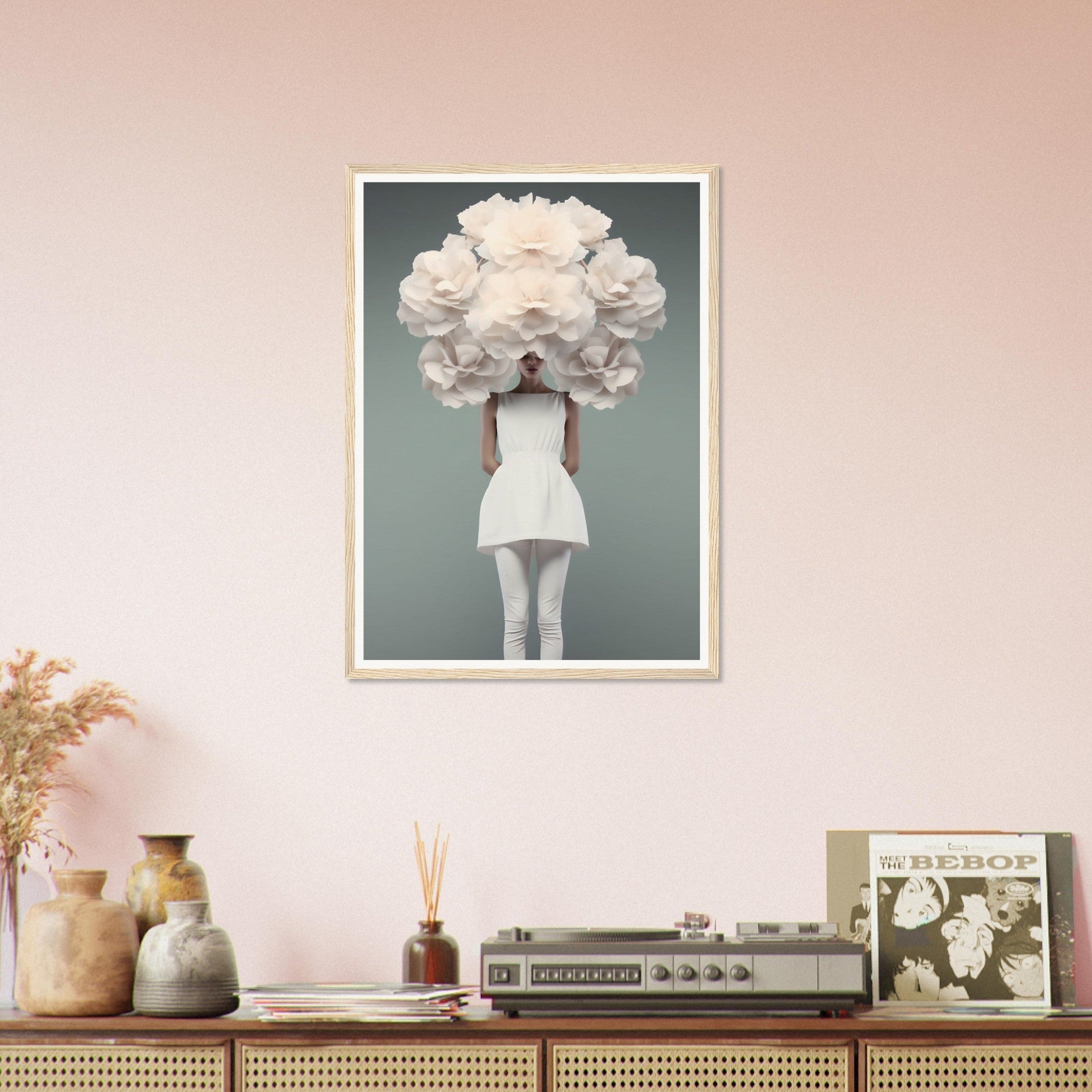 Framed surrealist photograph of a person with an oversized white floral headdress obscuring their face.