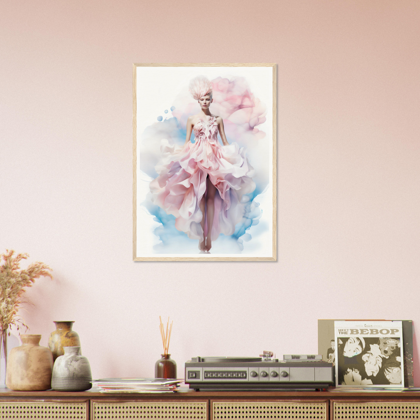 Framed artwork depicting a figure in a flowing pink dress against a pastel background.