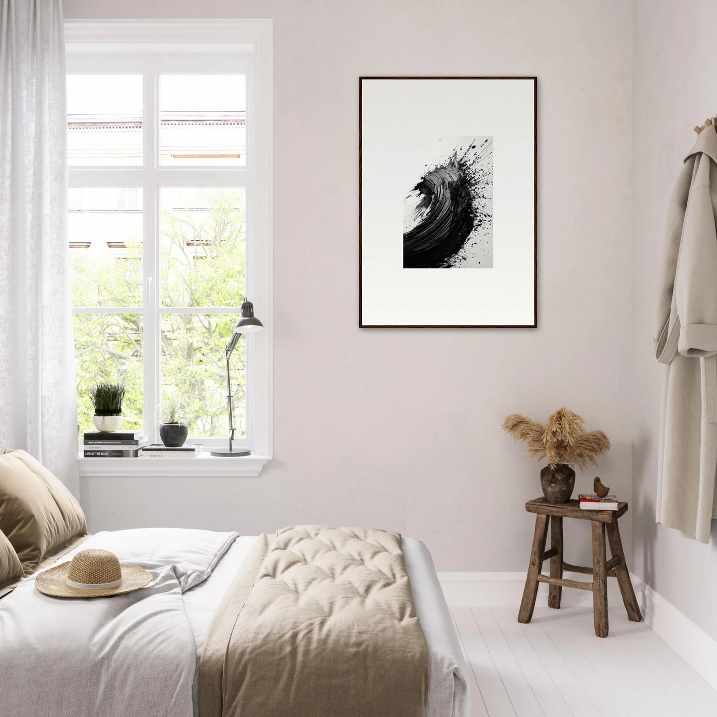 Minimalist bedroom featuring black and white abstract framed wall art for stylish room decor