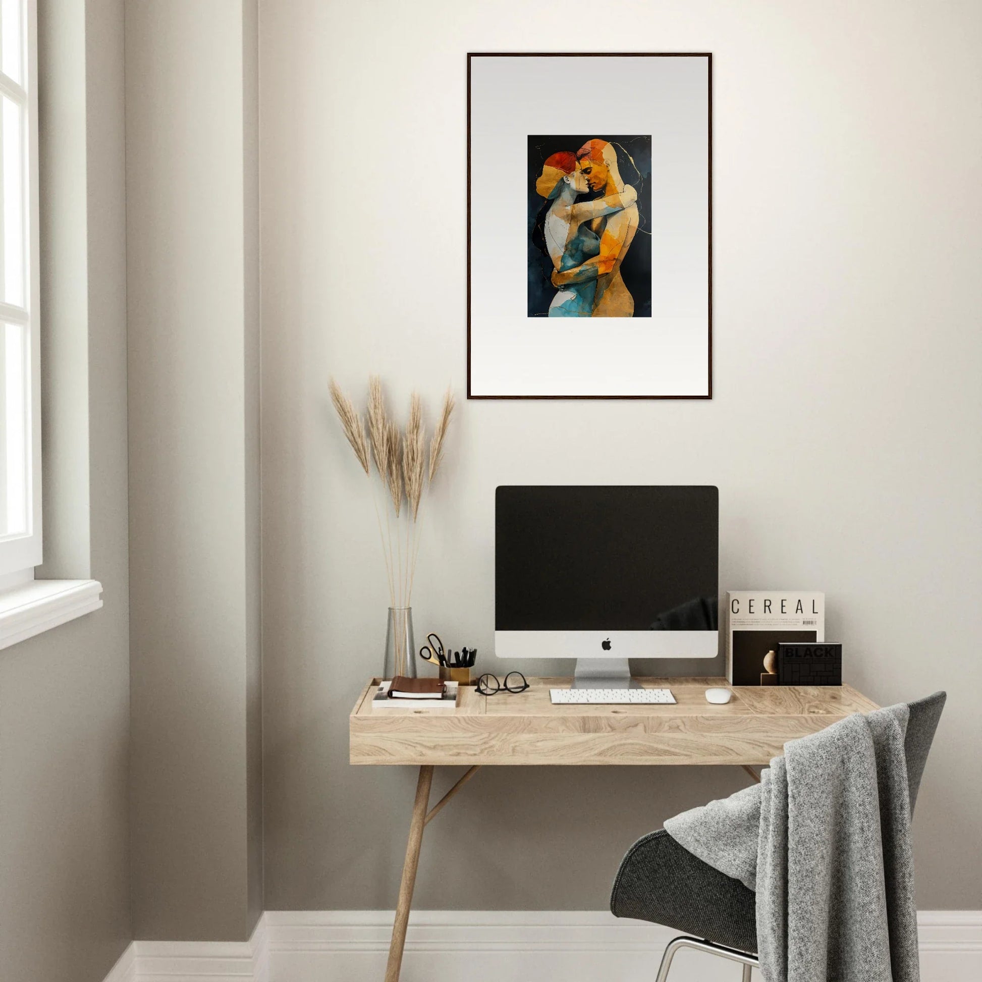 Minimalist home office with wooden desk, computer, and Embrace Waves framed wall art