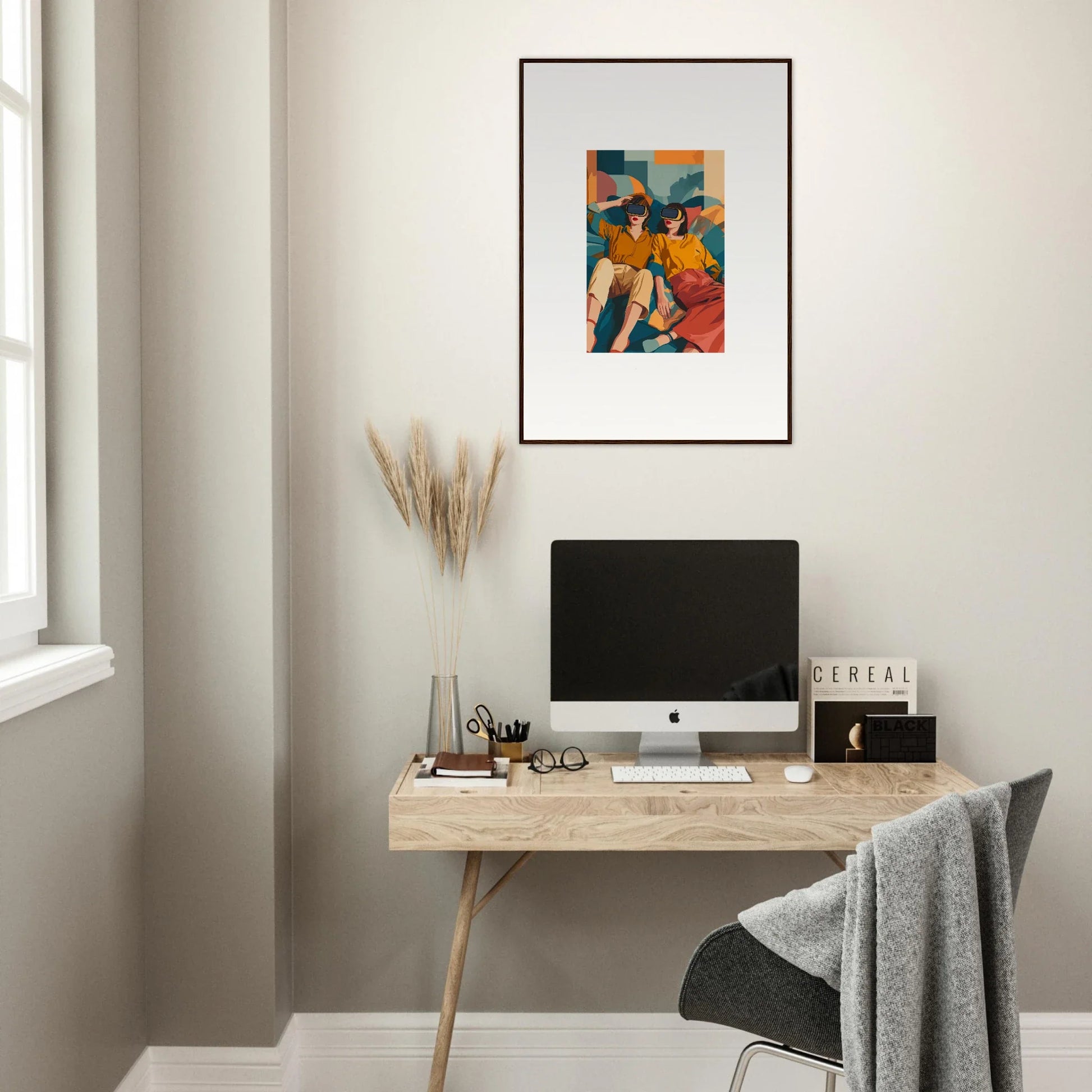 Minimalist home office with wooden desk, computer, and Matrix Enigma framed wall art