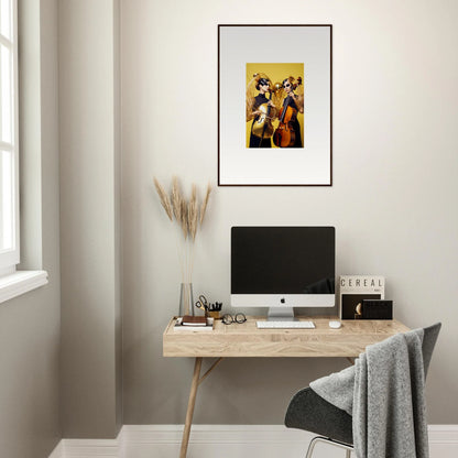 Minimalist home office with a wooden desk, computer, and framed wall art decor