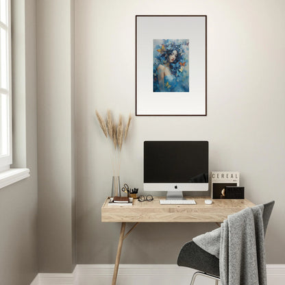 Minimalist home office with wooden desk, computer, and dream rhapsody framed wall art