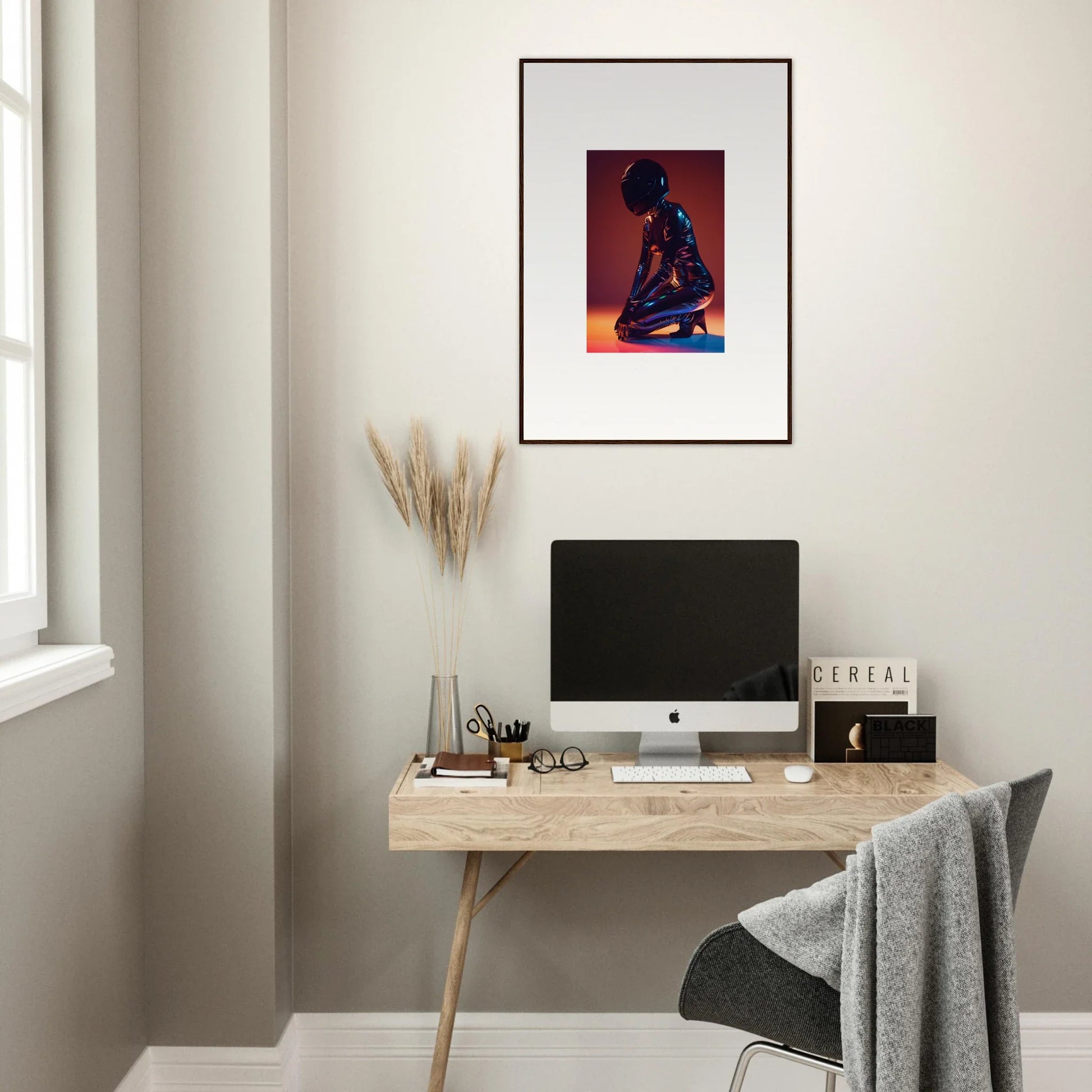 Minimalist home office with a wooden desk, computer, and Night Oracle framed wall art