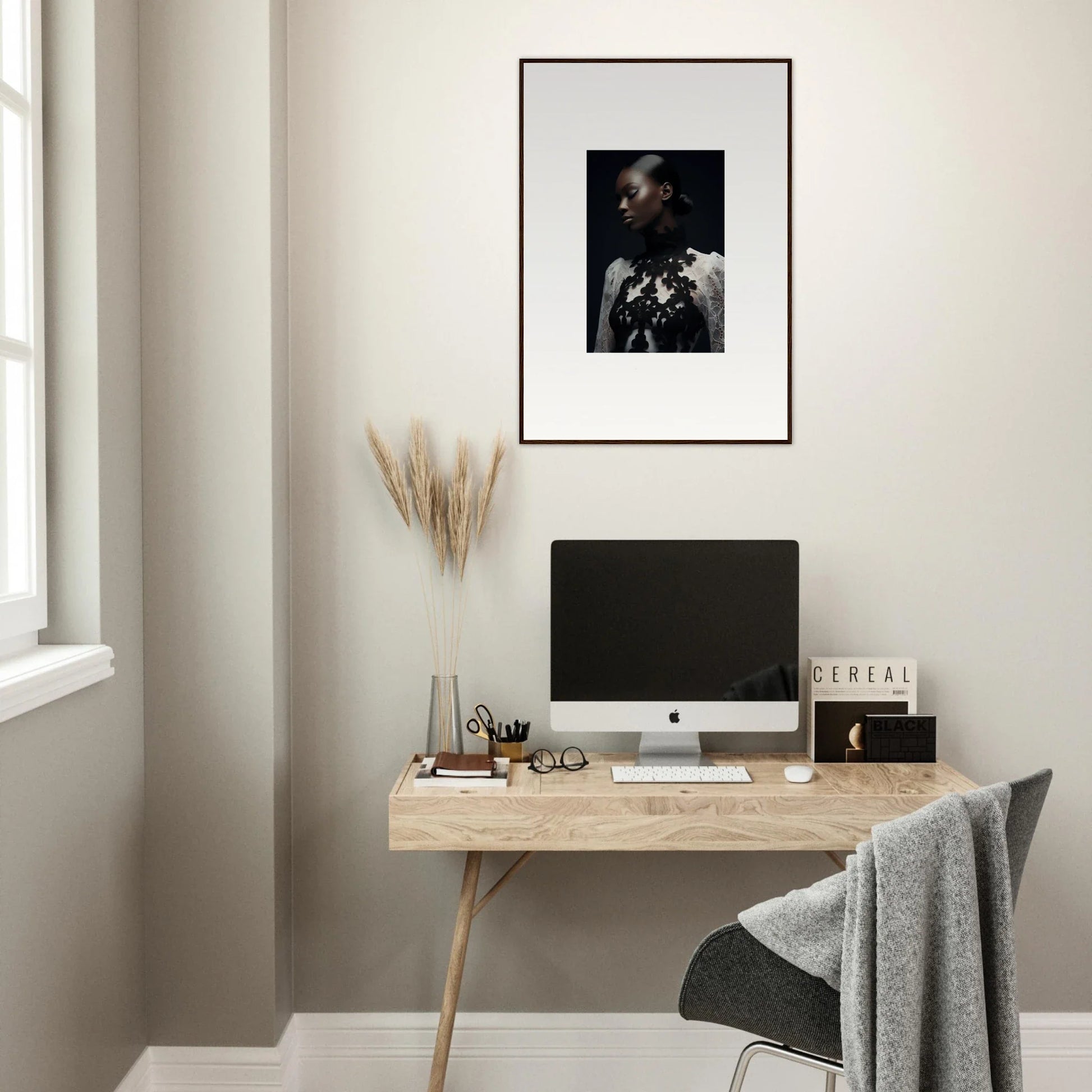 Minimalist wooden desk with a computer and stylish room decor accents