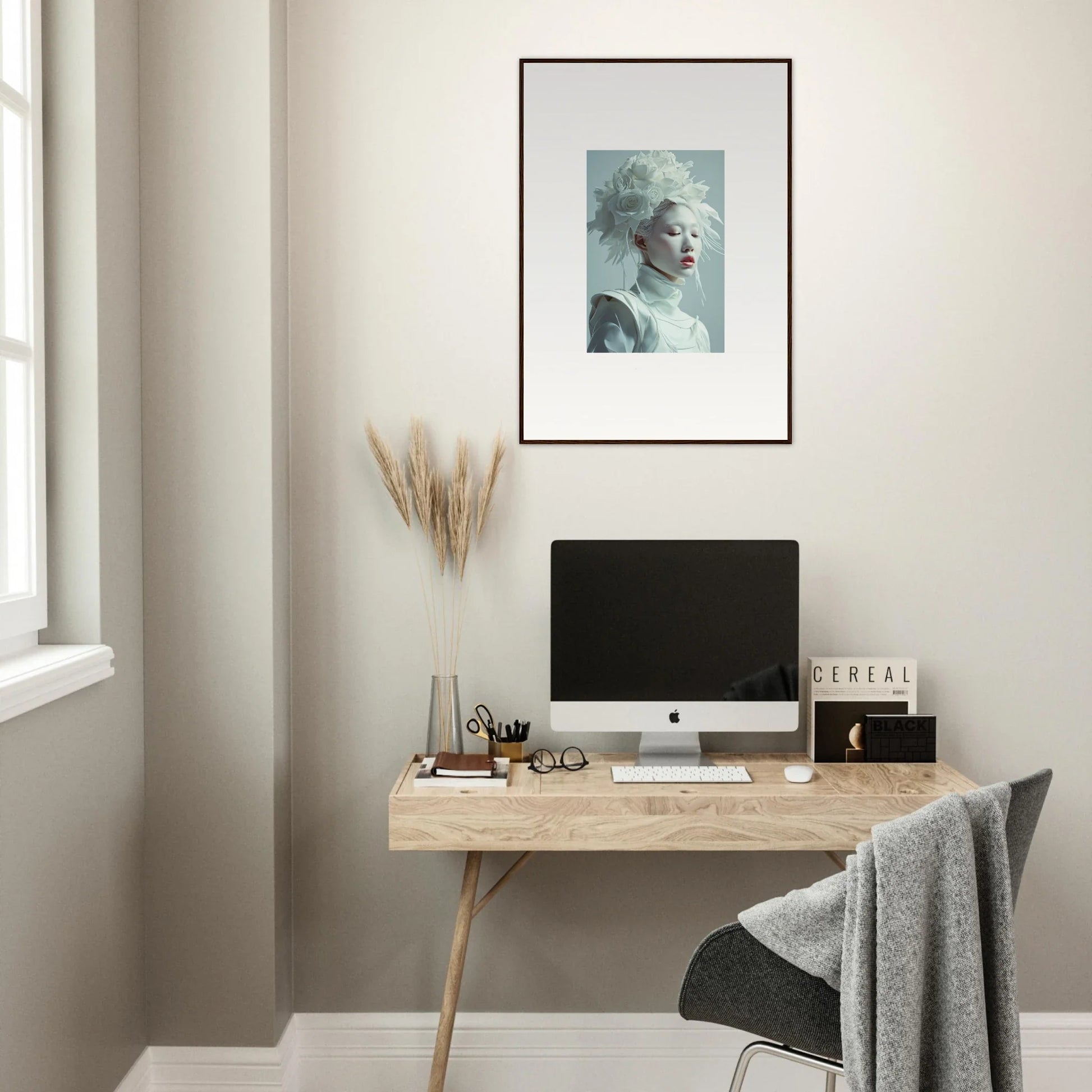 Minimalist wooden desk with a computer and framed wall art for stylish room decor