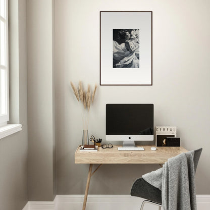 Minimalist wooden desk with computer monitor and Blush Reverie framed wall art