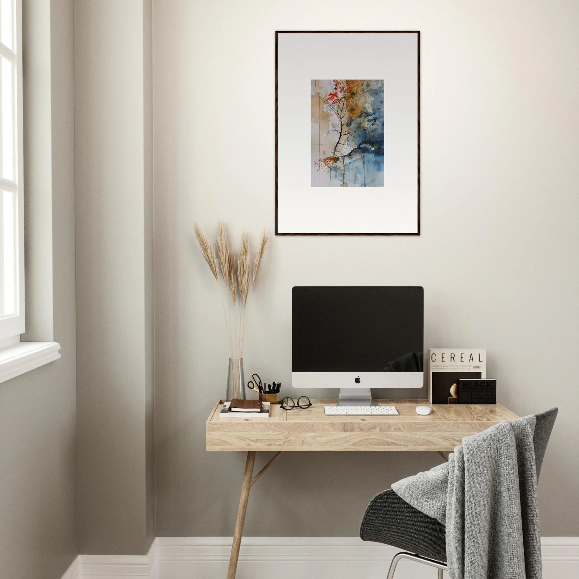 Minimalist wooden desk with computer, Spectrum Spoon and framed wall art for room decor