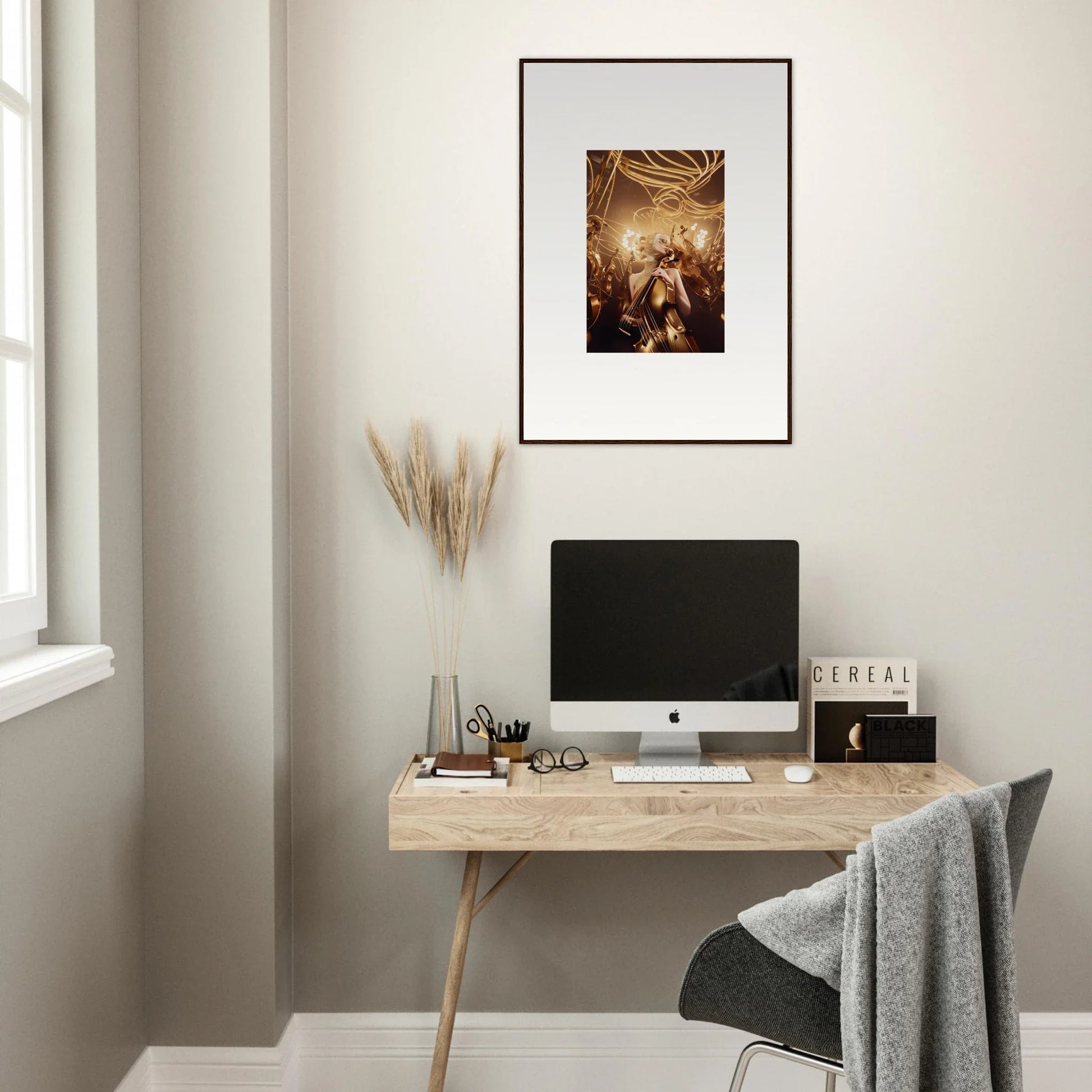 Minimalist wooden desk with computer monitor and framed wall art for stylish room decor