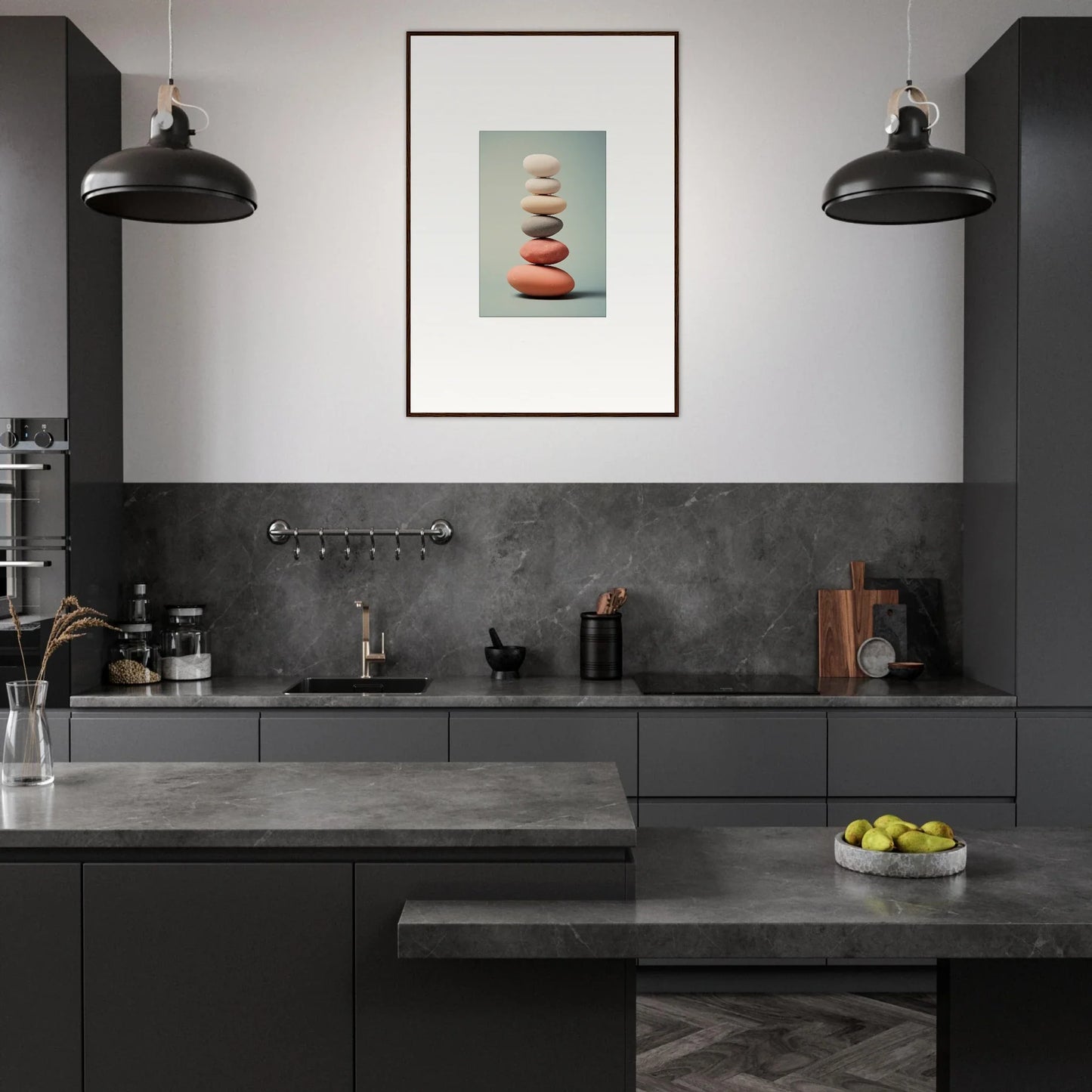 Modern kitchen with dark cabinetry and framed wall art of balanced stones