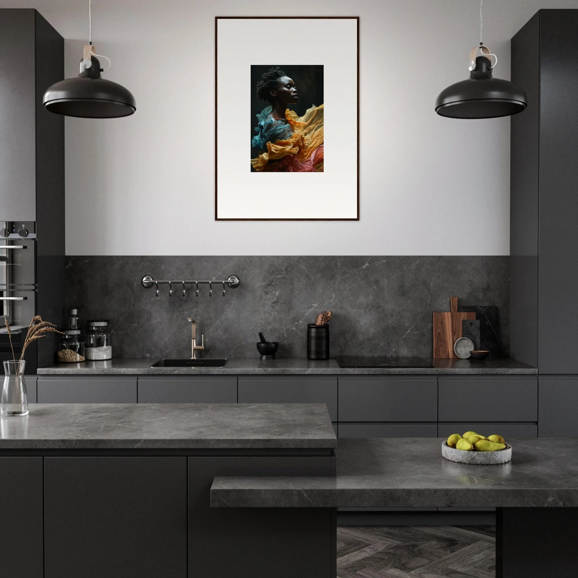 Modern kitchen with dark cabinetry and a striking framed portrait on the wall.