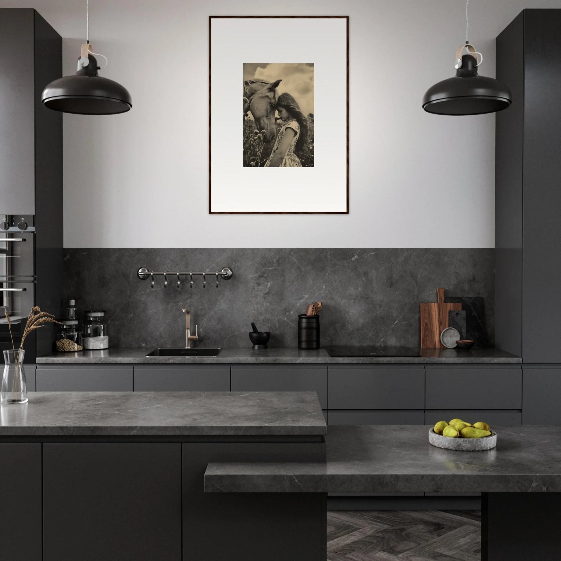 Modern kitchen with dark gray cabinetry, pendant lights, and framed wall art decor