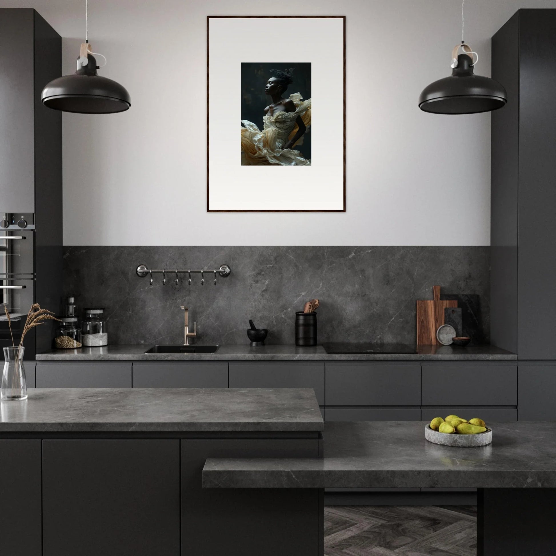 Modern kitchen with dark gray cabinetry and countertops, featuring pendant lights and a framed artwork on the wall.