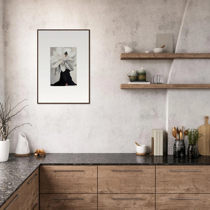 Modern kitchen with wooden cabinetry, black countertops, and framed wall art for room decor