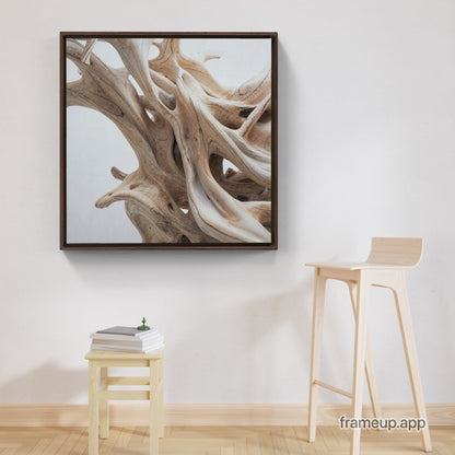 A framed Driftwood dance - XXL Framed Traditional Stretched Canvas on a wall next to a stool.