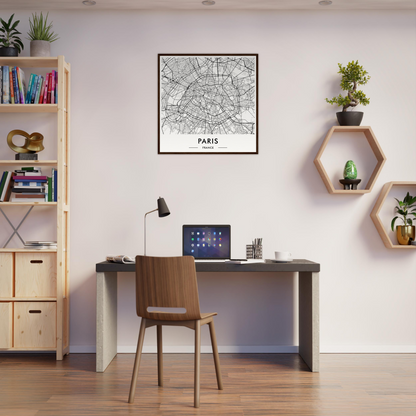 Simple home office workspace with a desk, chair, and wall decorations.