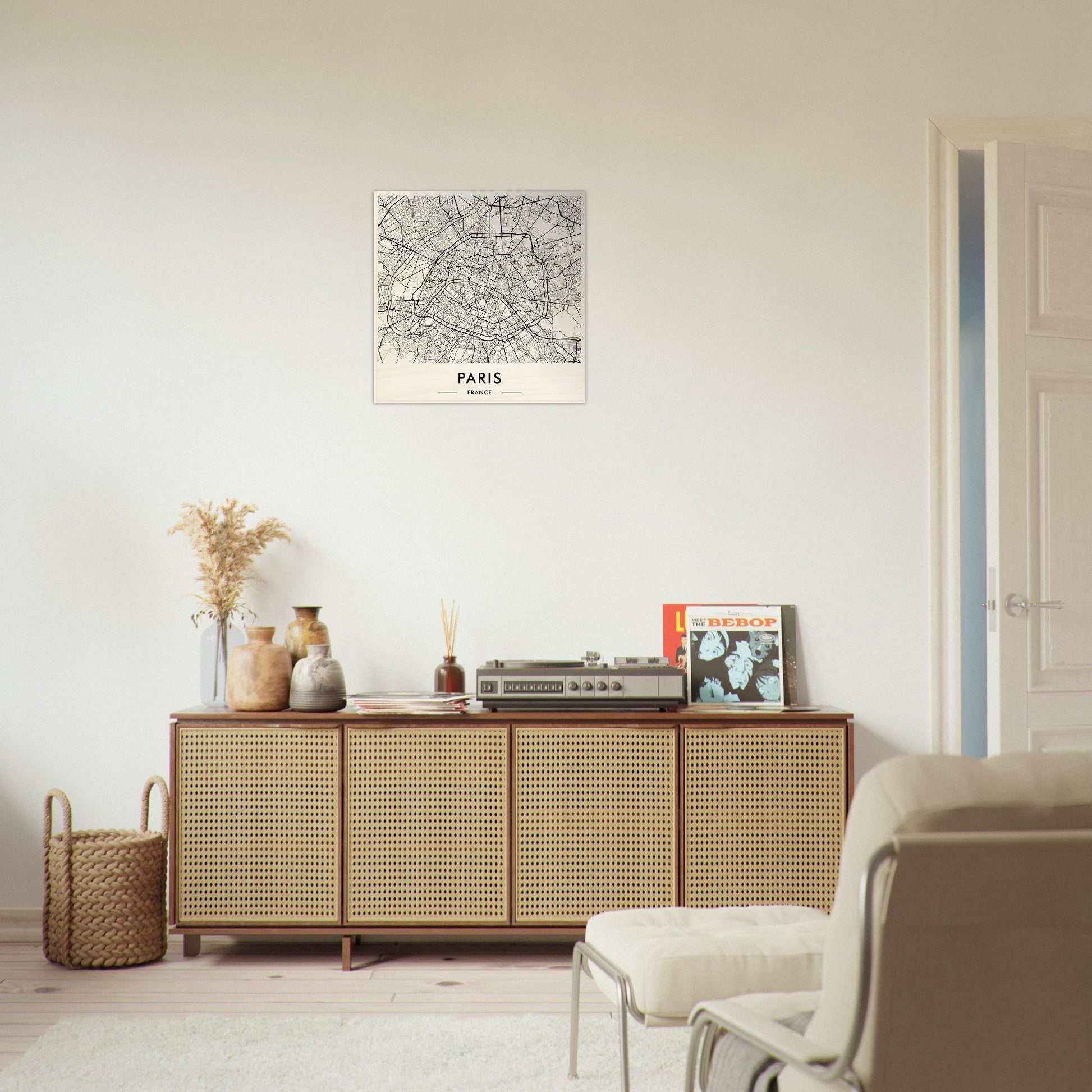 Wooden sideboard with cane-webbed doors and decorative items on top.