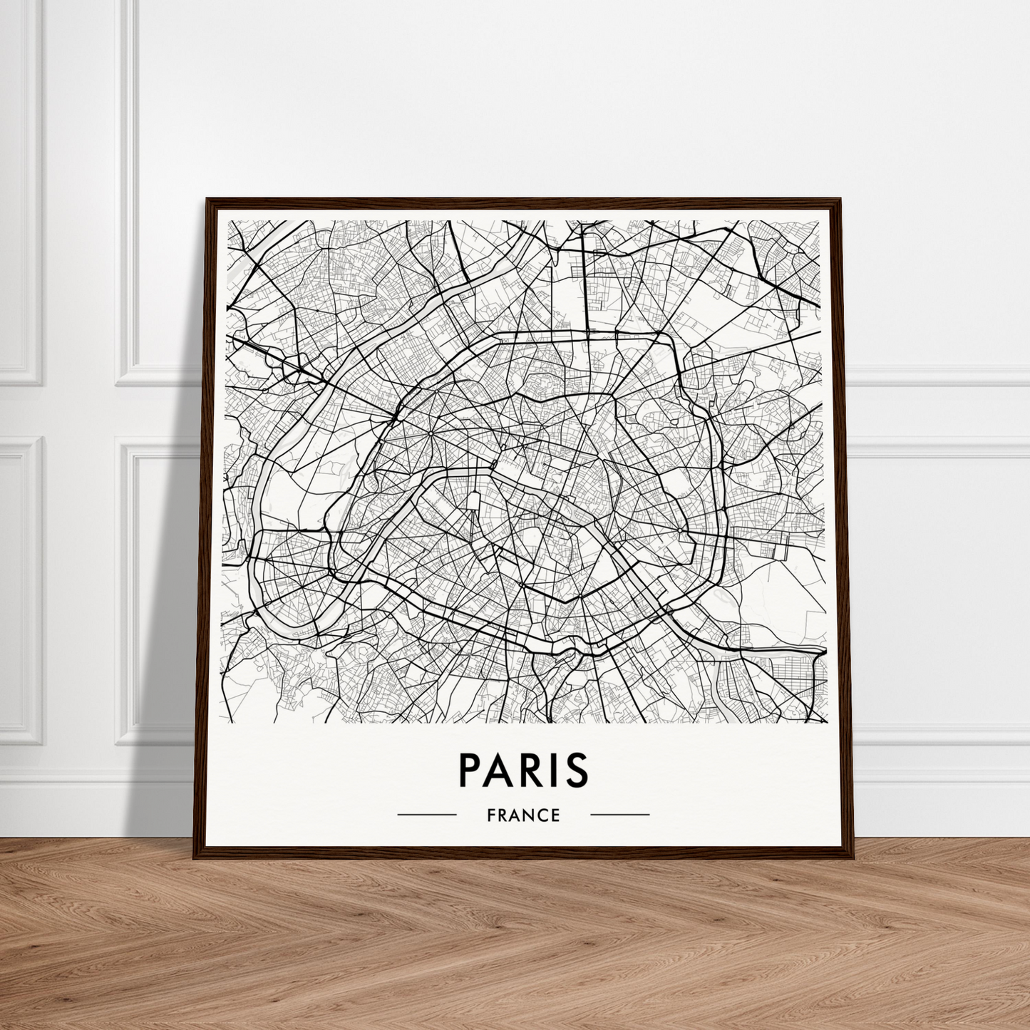 Framed map of Paris, France showing the city’s street layout in black and white.