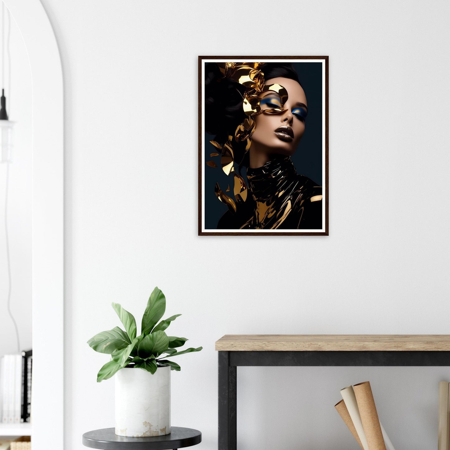 Framed portrait of a person adorned with gold leaf and dramatic makeup against a dark background.