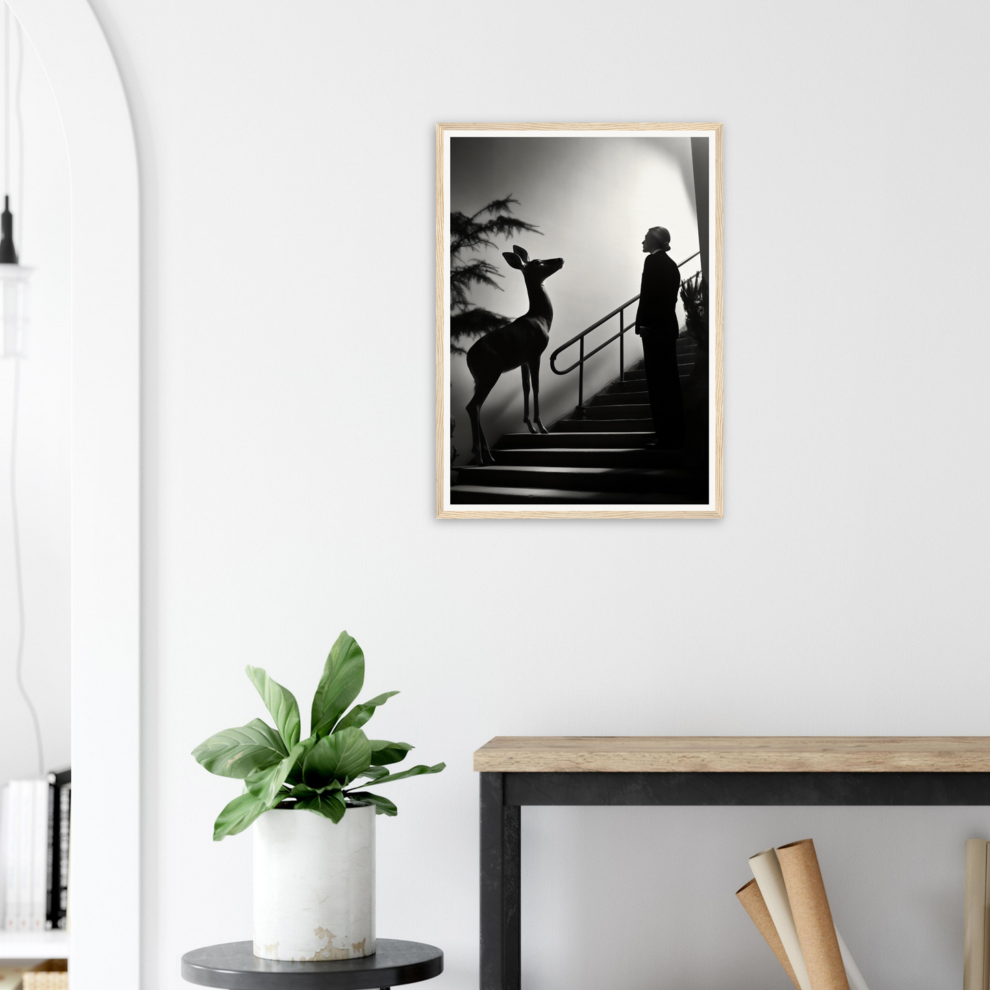 Framed black and white photograph showing a silhouette of a person and a deer on stairs.