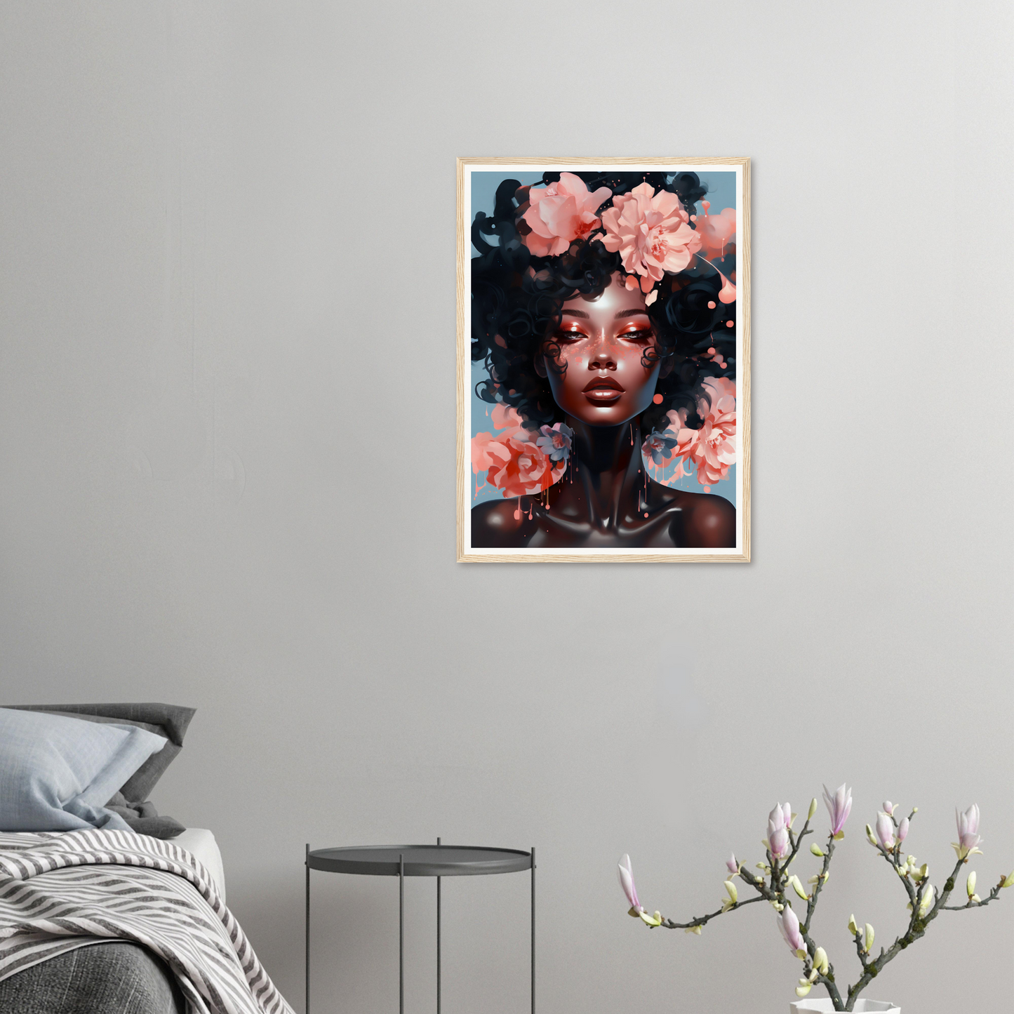 Portrait of a person with an afro hairstyle adorned with pink flowers.