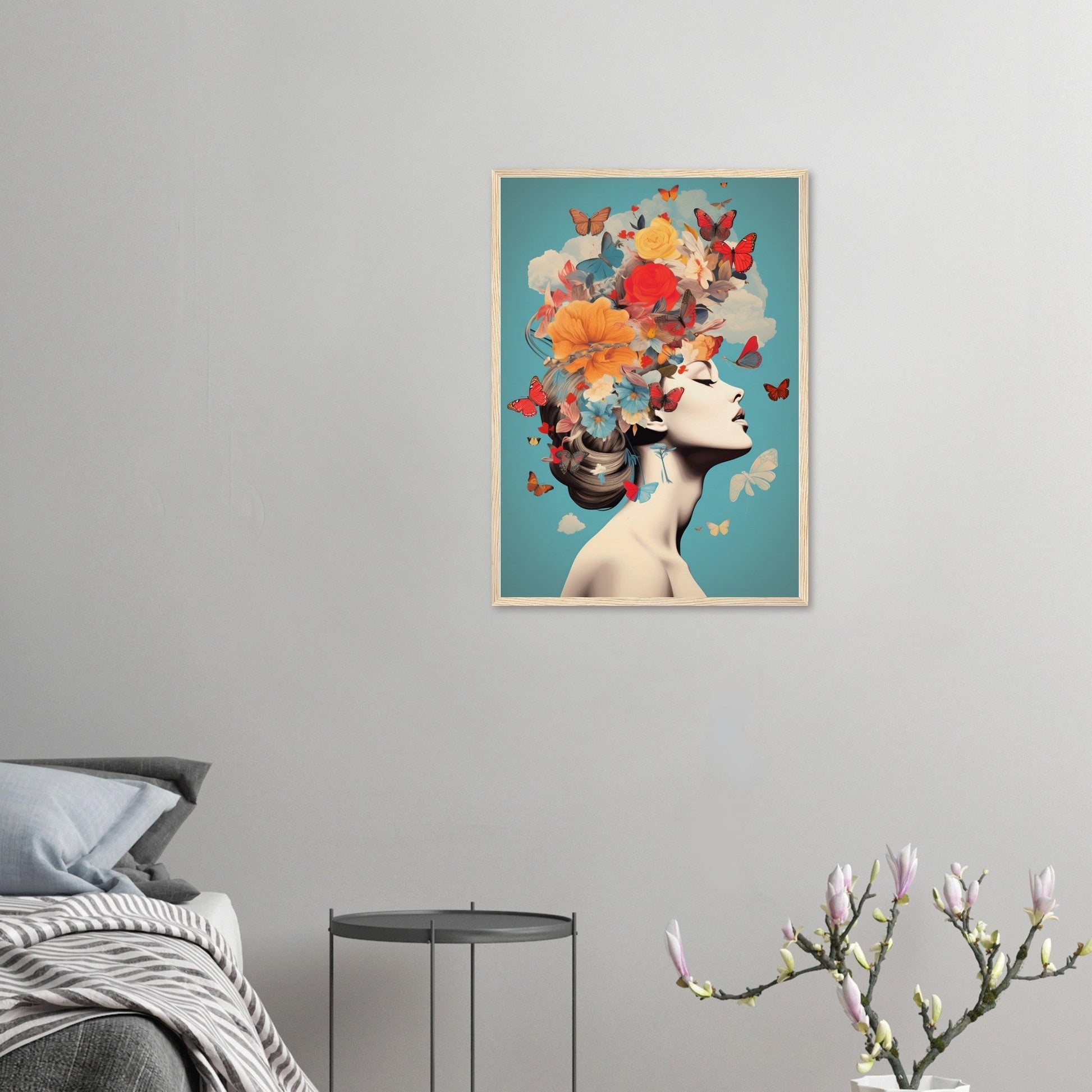 Framed artwork depicting a woman’s profile with colorful flowers and butterflies as her hair.