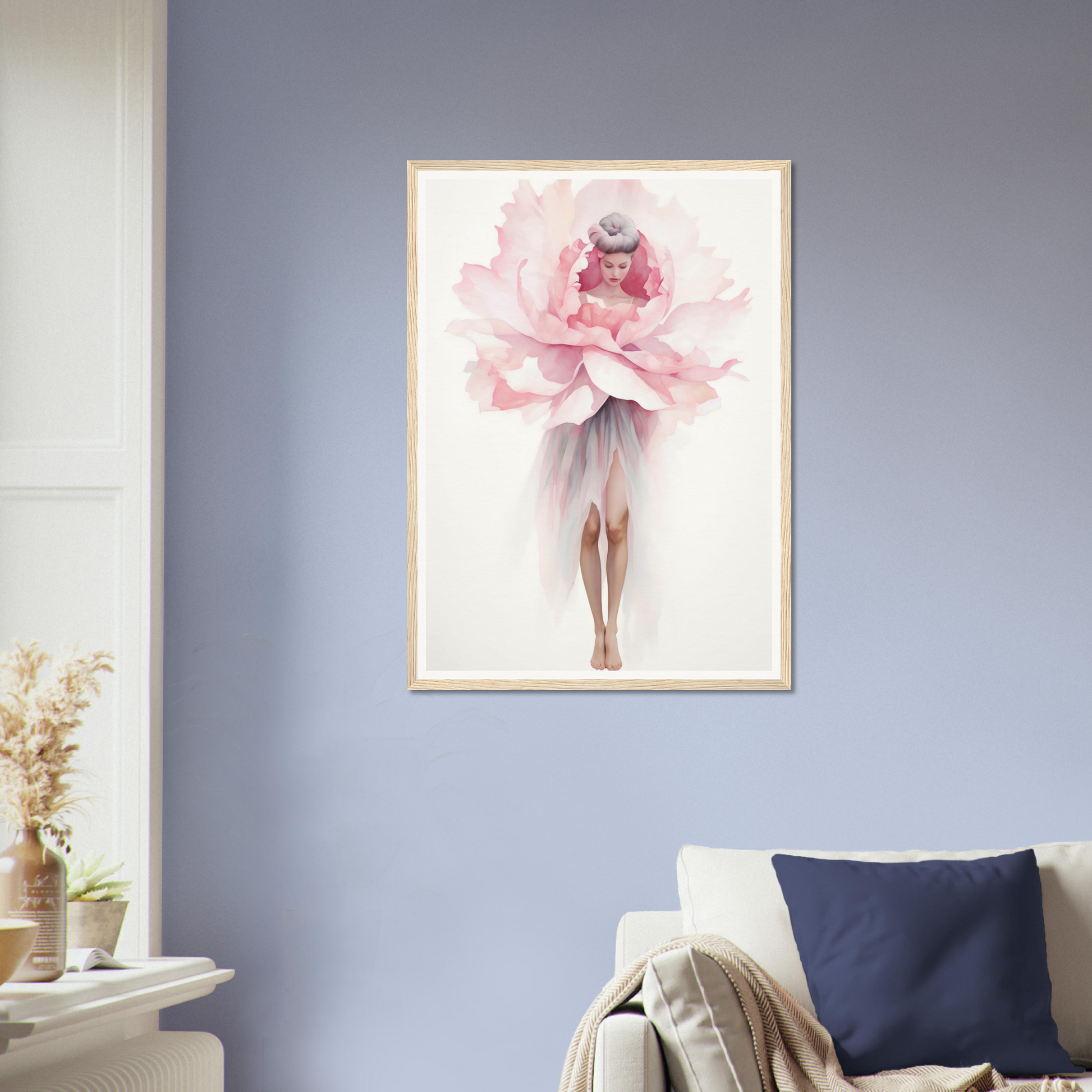 A pink flower in a white frame on a blue wall