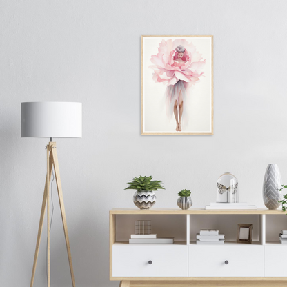 A pink flower in a white vase on a white wall