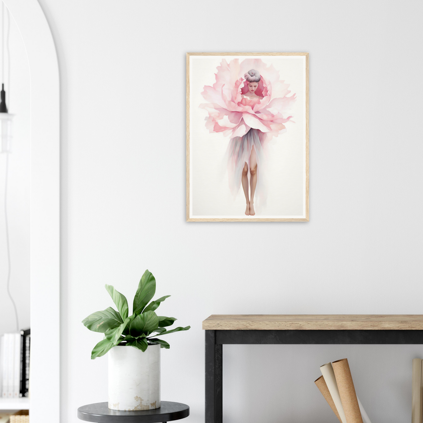 A pink flower in a white vase on a table