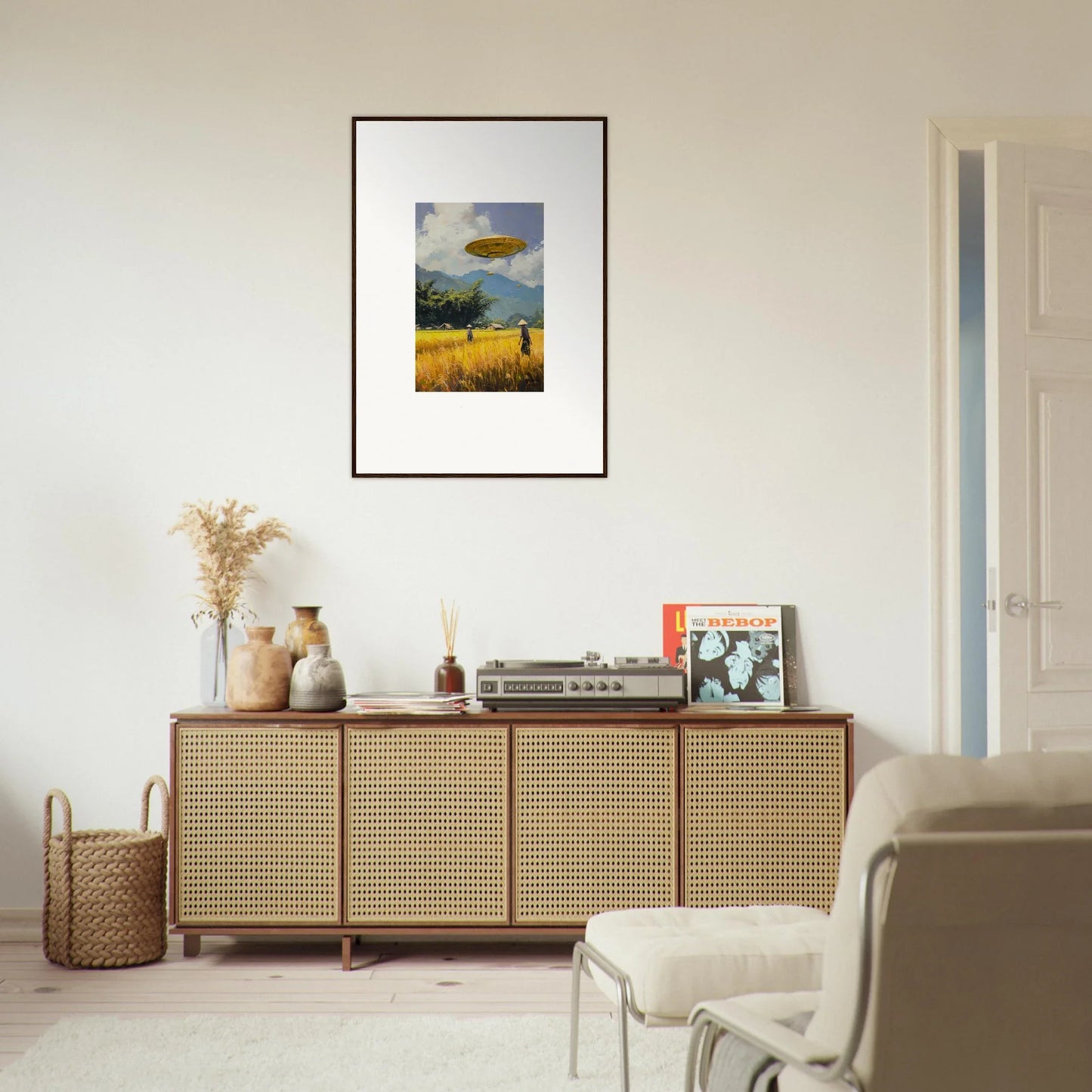 Rattan-fronted wooden sideboard with decorative items and Circles Kabuki framed wall art