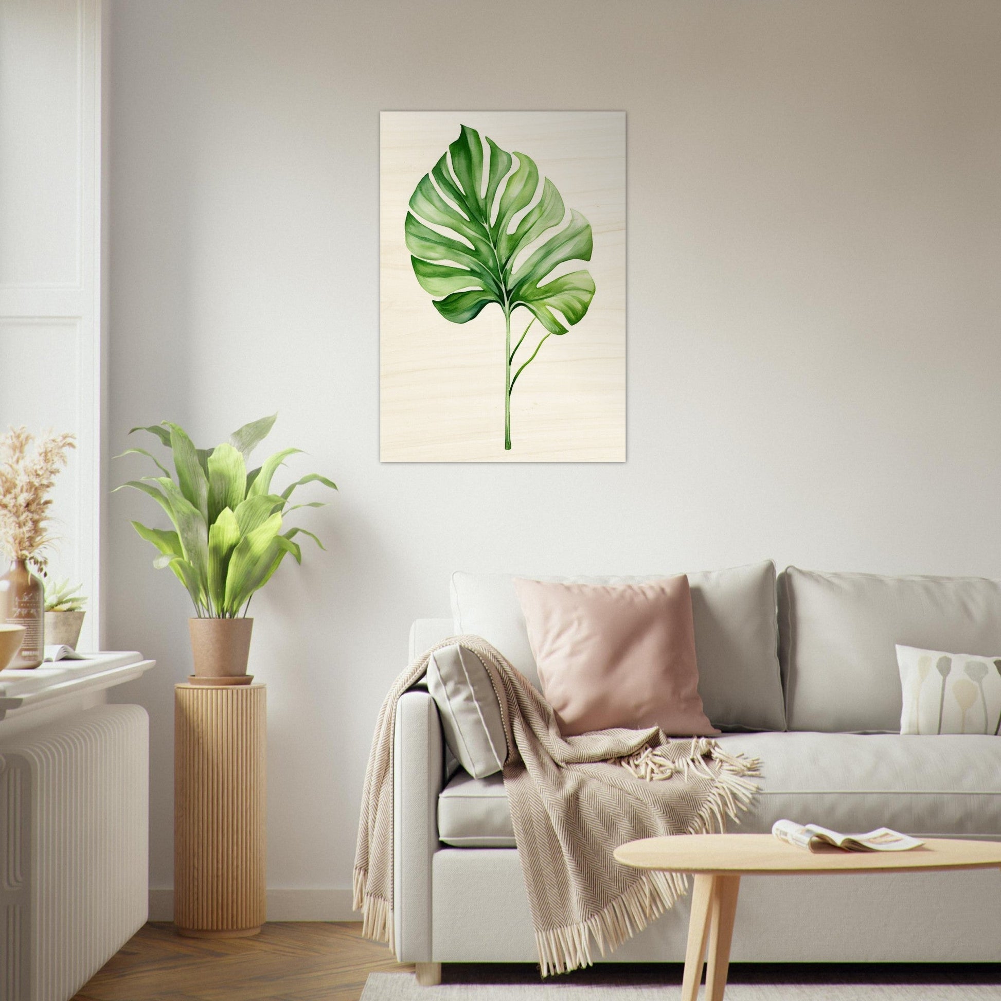 A living room with a couch and a large green leaf on the wall