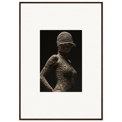 Sculptural figure with textured skin and a knitted cap.