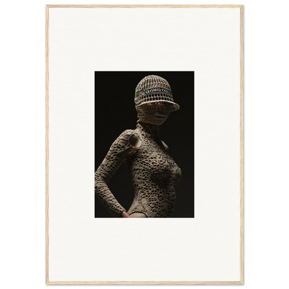 Sculptural figure with textured skin and a knitted cap.