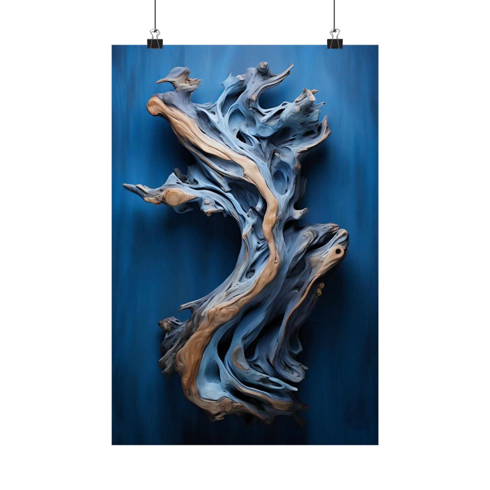 Swirling, abstract wooden sculpture with blue and tan tones resembling fluid motion.