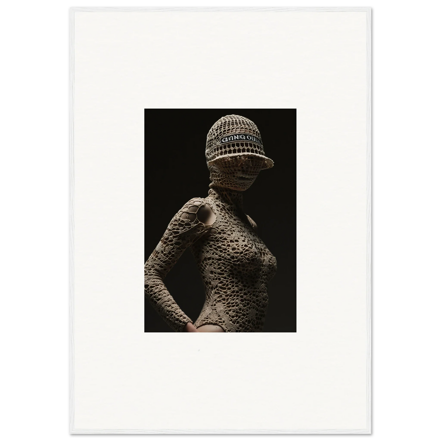 Shadowy figure with textured skin wearing a knitted cap.