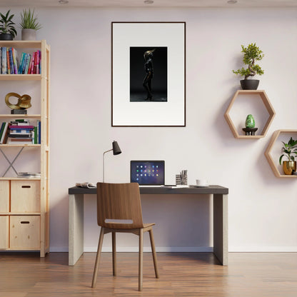 Simple home office workspace featuring a desk, chair, and framed wall art for room decor