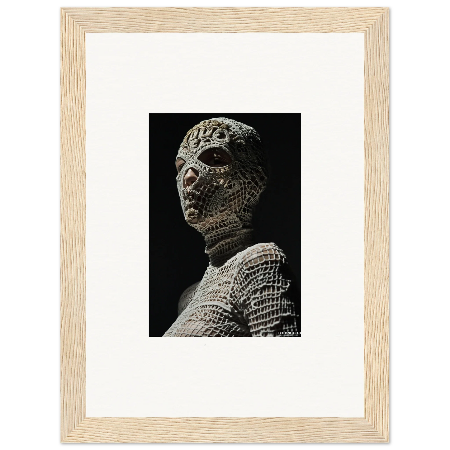 Stone sculpture of a humanoid figure with textured, scale-like skin.